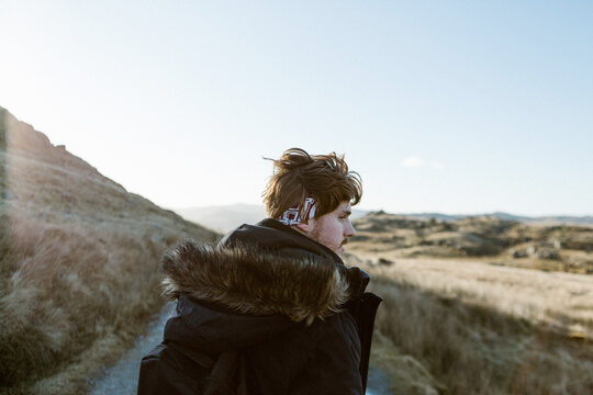 Man in winter coat on path near Dow Crag in soft morning light