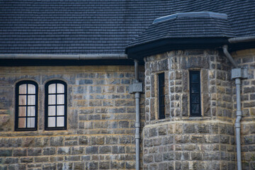 Historic Stone Building with Turret and Arched Windows