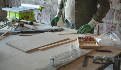 Caucasian carpenter working in a workshop.