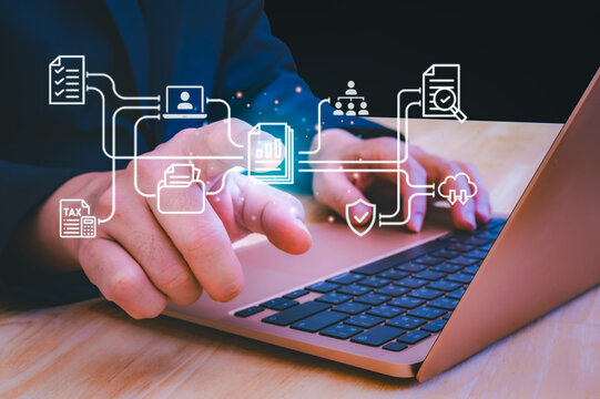Businessman using digital data analytics interface and financial dashboard on tablet and laptop in  office