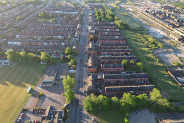 Aerial top down view of houses in England - with typical British houses and green gardens - Real estate and buildings concepts in UK.