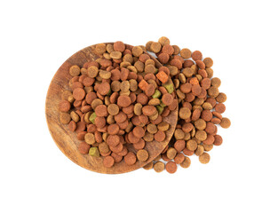 Dry pet food, dog color kibble pile, puppy meat and vegetable pellets, canine protein granules
