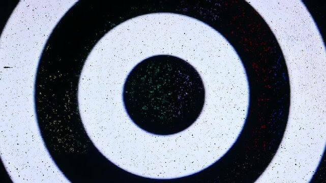 Video of hypnotic circles with noise and static from a video cassette player. All original elements manipulated on damaged analog tape, captured with a 4K camera.