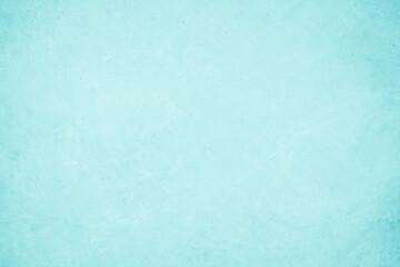 Pastel blue and white concrete stone texture for background in summer wallpaper. Cement and sand wall of tone vintage. Concrete abstract wall of light cyan color, cement texture mint green for design.