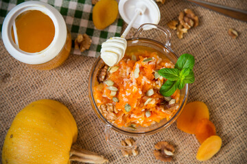 Cooked pumpkin porridge with rice, nuts and honey