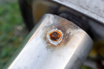 Corroded iron bolt macro on weathered steel