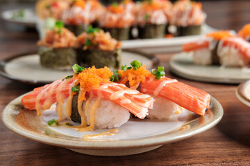 Crab Stick Sushi with Mayonnaise and Tobiko with copy space.
