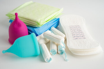 Menstruation cycle with sanitary pad and cotton tampon for woman hygiene and protection.