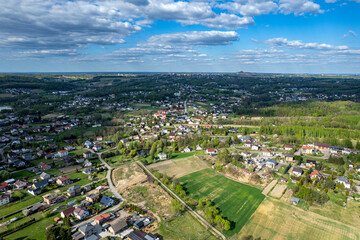 Aerial View of a Small Town Surrounded by Fields and Forests