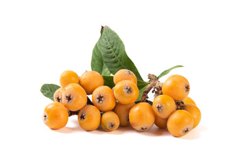 Ripe perfect loquats fruits with green leaves isolated on white background.