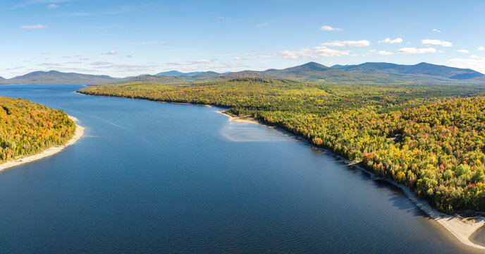 Aerial view of First Roach Pond in Maine with fall foliage and tranquil landscape