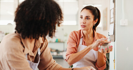 Pottery class, advice and woman in ceramic workshop with help, achievement and clay product. Man, small business and mentor in studio with support, feedback and sculpture design mold with instructor