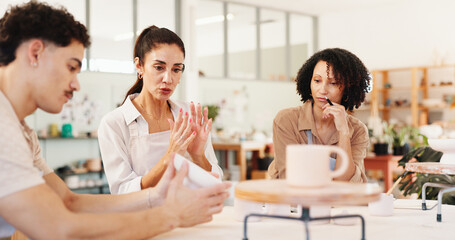 Pottery, art class and people with clay in workshop for teaching, learning and skills development. Creative, studio and man and woman with ceramic mold for design, sculpture and DIY hobby in lesson