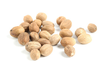 Pile of fresh nutmegs isolated on white