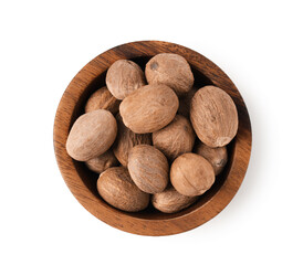 Nutmegs in bowl isolated on white, top view