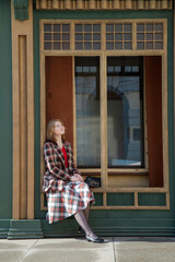 young beautiful woman in vintage suit in european city