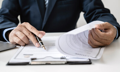 Business man employer holding resume hiring recruit looking cv resume to hire candidates, analyzing information before job interview. Recruitment concepts
