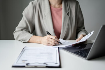 Business woman employer holding resume hiring recruit looking cv resume to hire candidates, analyzing information before job interview. Recruitment concepts