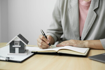 cagents working in real estate investment and home insurance signing contracts in accordance with the home buying insurance agreements approving purchases for clients