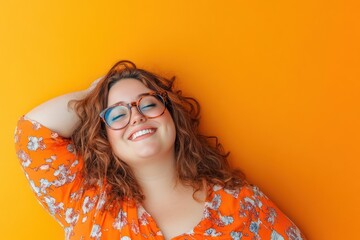 Happy plus size woman in glasses smiling confidently