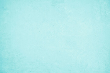 Pastel blue and white concrete stone texture for background in summer wallpaper. Cement and sand wall of tone vintage. Concrete abstract wall of light cyan color, cement texture mint green for design.