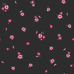Vector illustration. Seamless pattern of delicate small pink flowers on a black background. Ditsy floral pattern, field of flowers, print for fabric, textile, wallpaper, print for dress