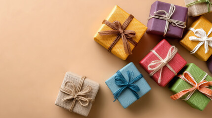 Gift boxes with ribbons and bows on a beige background