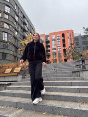 Smiling Woman Outdoor Portrait. blonde hair fashion model wears stylish clothes. Fashion trend of autumn 