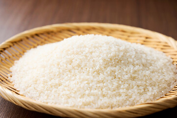 Serving raw Japanese rice in a bamboo sieve