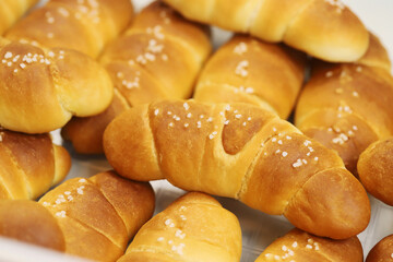 Freshly baked bread rolls Shio Pan, perfect for breakfast or bakery product marketing, delicious golden crust and soft texture. pieces to accompany food.