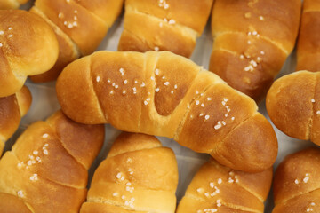 Freshly baked bread rolls Shio Pan, perfect for breakfast or bakery product marketing, delicious golden crust and soft texture. pieces to accompany food.