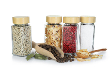 Many different aromatic spices in jars isolated on white