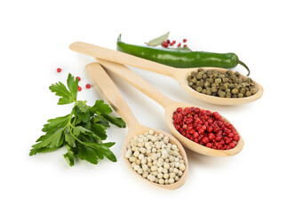 Different aromatic spices and spoons isolated on white