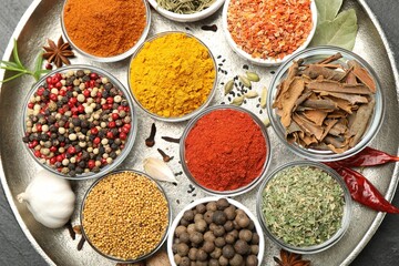 Different aromatic spices on table, top view