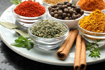 Many different aromatic spices on table, closeup