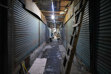 Lively street view of a traditional Korean market with diverse buildings and shops.