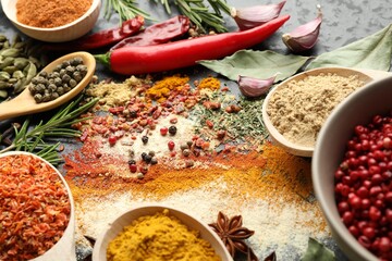 Different aromatic spices on black background, closeup