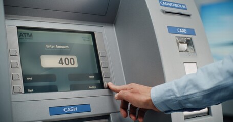 Cash Machine in Airport Terminal: Man Inserting Card, Pressing Buttons on ATM Keypad, Entering PIN Code for Cash Withdrawal Transaction. Automated Teller Machine, Banking Services. Close Up Shot.