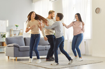 Happy family with children sharing moments of joy and laughter while having fun at home. Children...