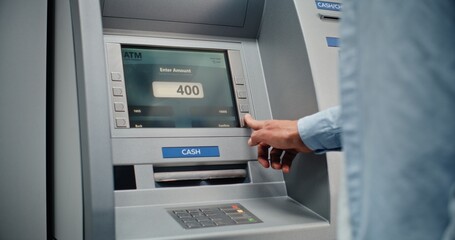 ATM Machine: Unrecognizable Man Entering PIN Code on Keypad, Choosing Money Withdrawal Transaction, Entering Amount and Taking US Dollars from Cash Dispenser. Banking System and Operations. Close Up.