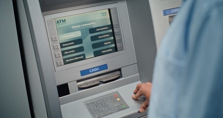 Cash Machine: Unrecognizable Man Entering PIN Code on Keypad, Choosing Withdrawal Money Operation,...