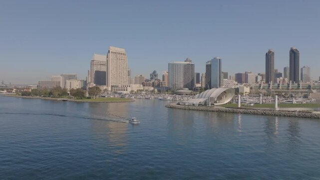 Aerial Panning Shot Of Famous The Rady Shell In Modern City, Drone Flying Over Sea On Sunny Day - San Diego, California