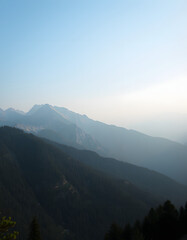 Majestic sweeping vista of towering peaks, Diffused lighting. with white shades