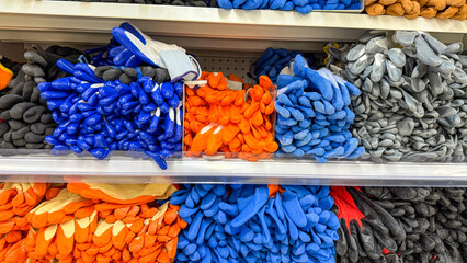 Kaleidoscope of colorful work gloves embodies International Workers Day spirit, tactile rainbow...