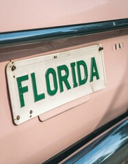 Vintage pink car with florida license plate in close-up view