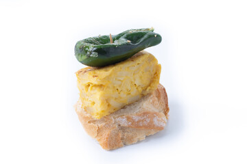 Spanish pincho with omelette and green pepper isolated on white background