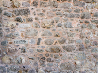 Closeup of old stone wall texture background