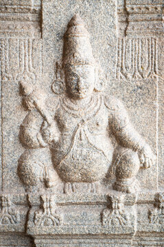 Ancient Jaya statue of dwarpal of Vishnu, Virupaksha temple of Hampi, carved into boulder, hinduism religion, god, ganesh at ruin of Vijayanagara Empire