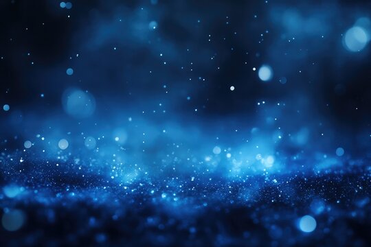 Dark blue bokeh background with glittering particles