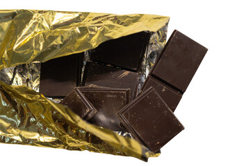 High resolution image of dark chocolate pieces in its shiny wrapper on white or transparent background